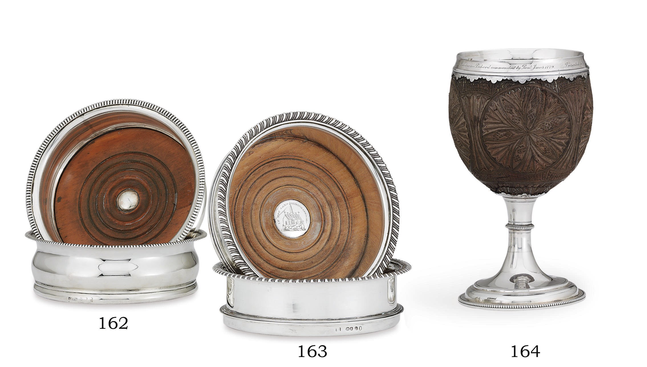 A PAIR OF GEORGE III SILVER WINE COASTERS