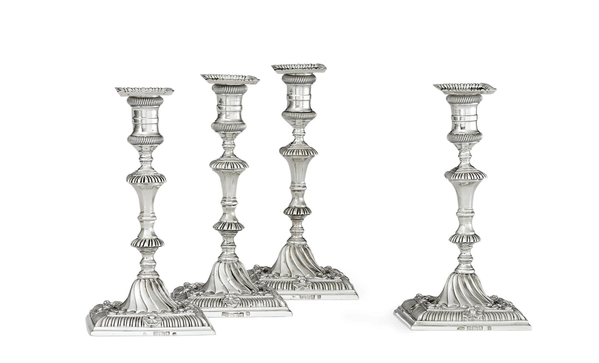 A RARE SET OF FOUR GEORGE III SILVER TAPERSTICKS