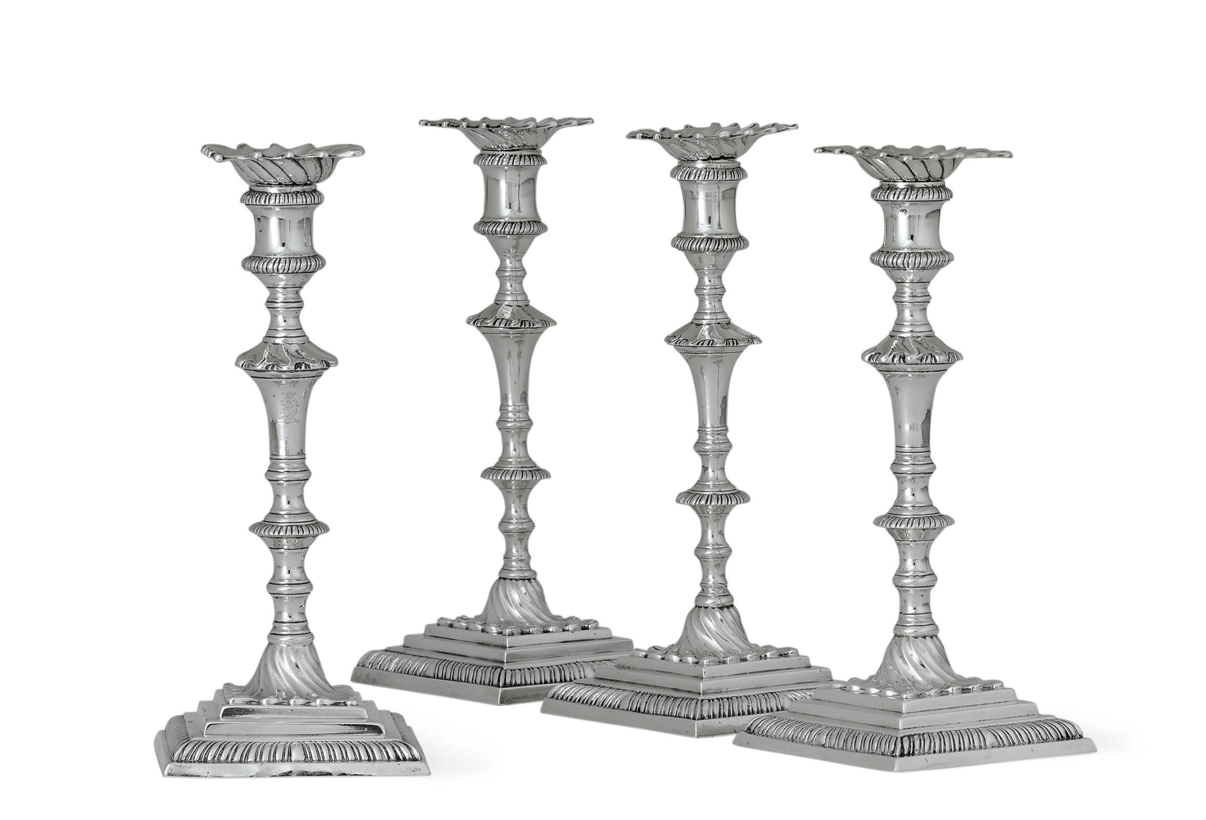 FOUR GEORGE III SILVER CANDLESTICKS