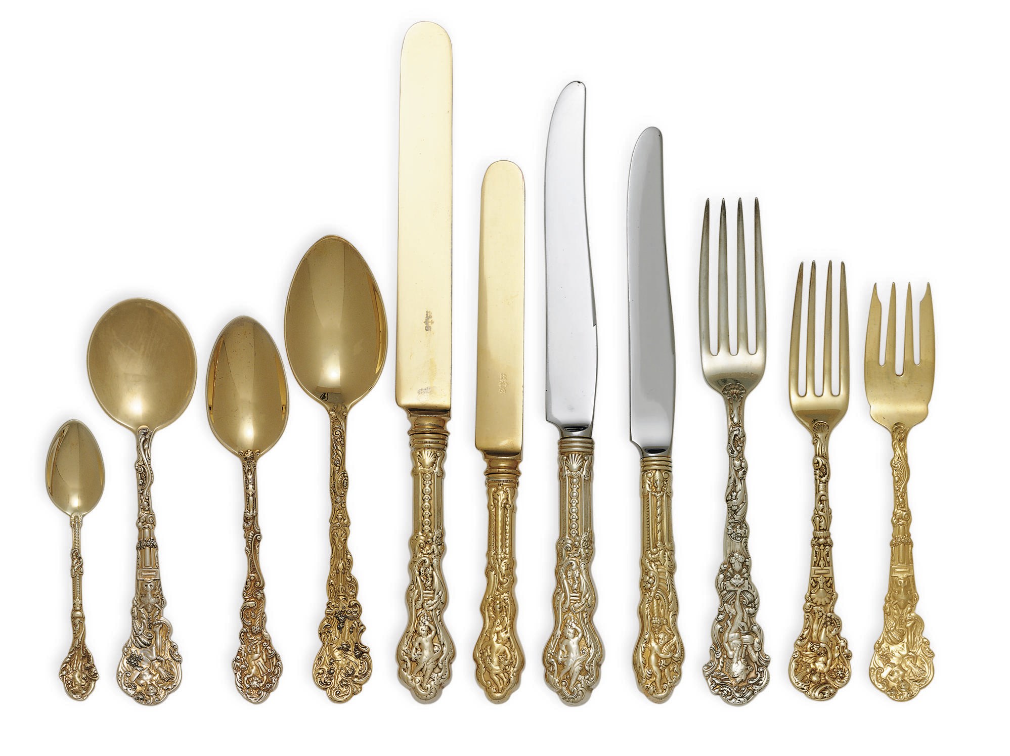 AN ASSEMBLED AMERICAN SILVER-GILT FLATWARE SERVICE