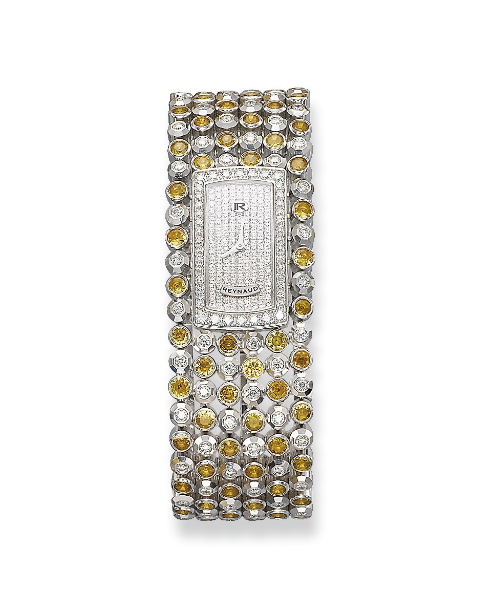 A LADY'S COLOURED SAPPHIRE AND DIAMOND 'GEMTWIST' WRISTWATCH, BY REYNAUD