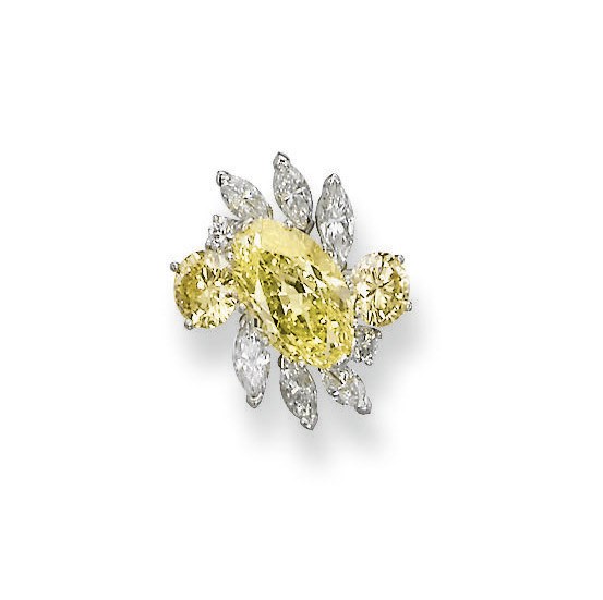 A COLOURED DIAMOND AND DIAMOND RING