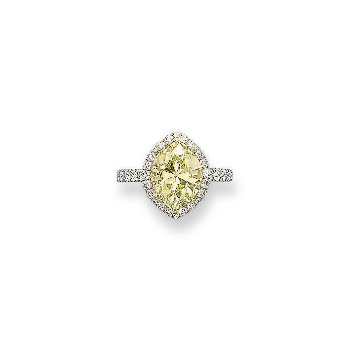 A COLOURED DIAMOND AND DIAMOND RING