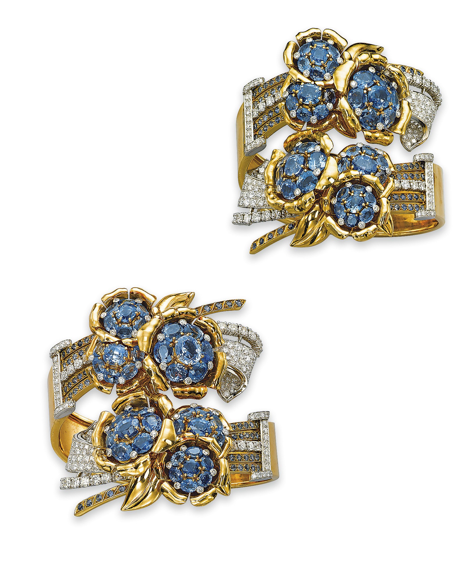 A PAIR OF IMPRESSIVE SAPPHIRE AND DIAMOND BANGLES, BY OSTERTAG