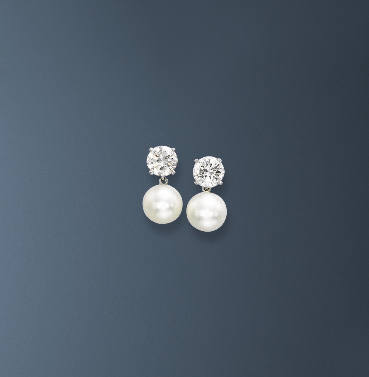A PAIR OF NATURAL PEARL AND DIAMOND EAR CLIPS