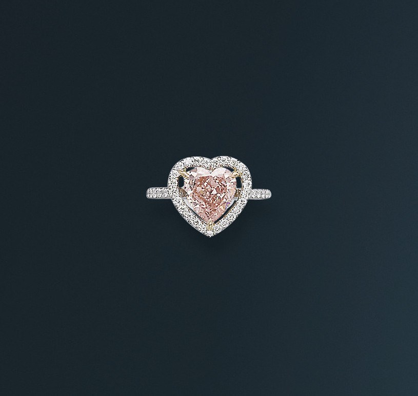 A DELICATE COLOURED DIAMOND AND DIAMOND RING
