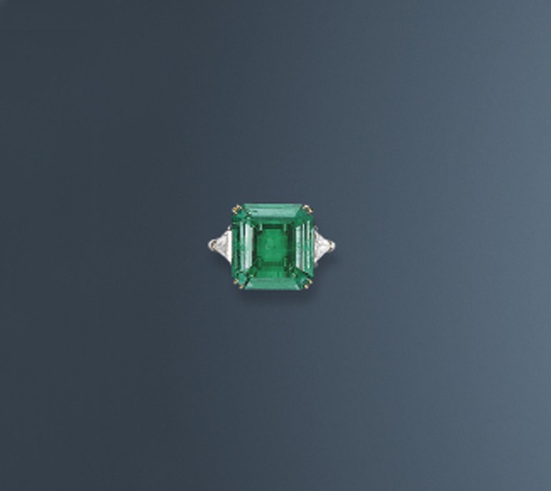 A MAGNIFICENT EMERALD AND DIAMOND RING, BY HARRY WINSTON