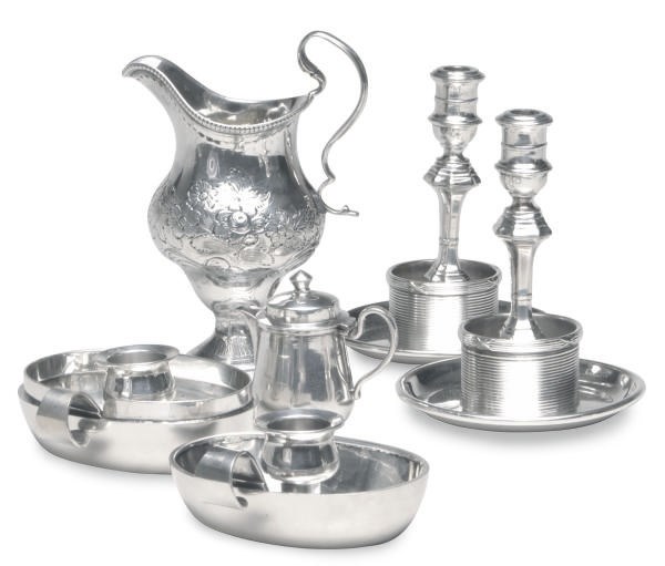 A DUTCH SILVER CREAM JUG, AN AMERICAN SILVER TRAVEL TAPERSTICK SET AND A SILVER-PLATED TRAVEL TAPERSTICK SET,