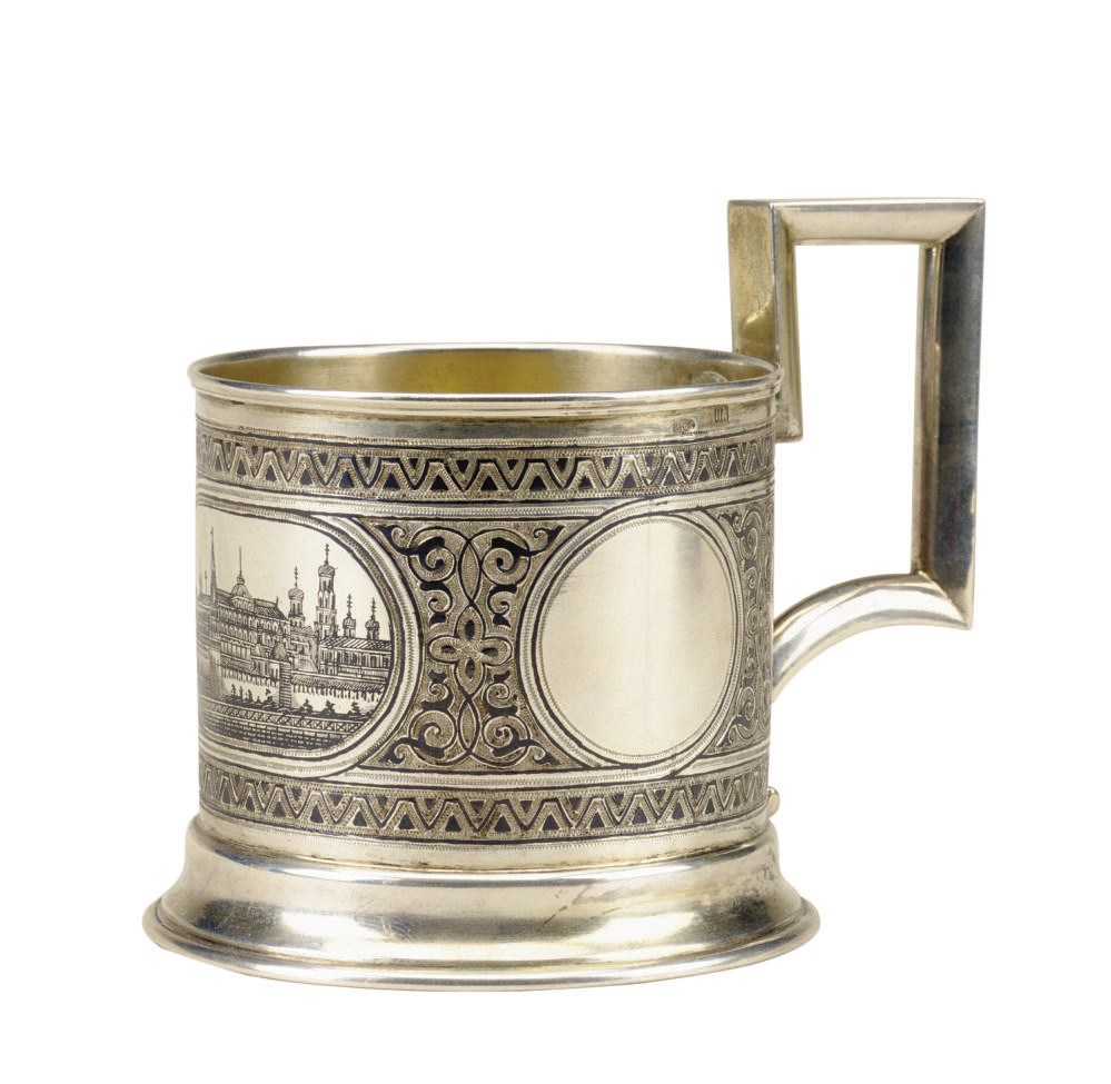 A RUSSIAN SILVER AND NIELLO TEA GLASS HOLDER,