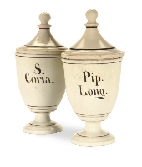 A PAIR OF CONTINENTAL EARTHENWARE DRUG JARS AND TWO COVERS,