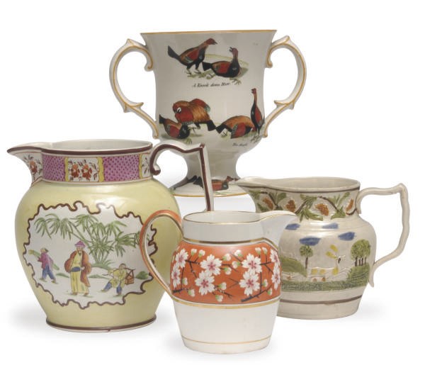 THREE STAFFORDSHIRE PEARLWARE JUGS AND A LOVING CUP,