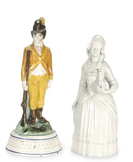 A STAFFORDSHIRE PEARLWARE FIGURE OF AN EROTIC TAVERN WENCH AND A FOOT SOLDIER,