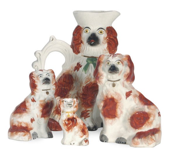 A GROUP OF STAFFORDSHIRE MODELS OF SEATED SPANIELS,