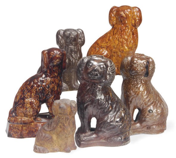 SIX STONEWARE AND EARTHENWARE MODELS OF SEATED SPANIELS,