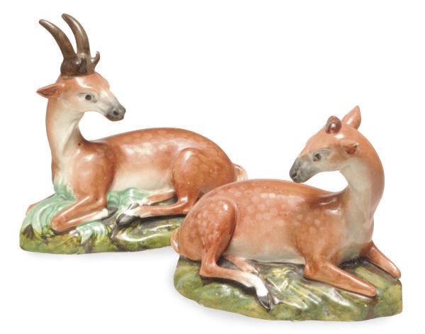 A PAIR OF STAFFORDSHIRE PEARLWARE MODELS OF A STAG AND HIND,