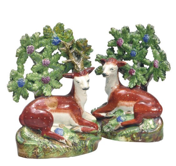 A PAIR OF STAFFORDSHIRE PEARLWARE BOCAGE MODELS OF A STAG AND HIND,
