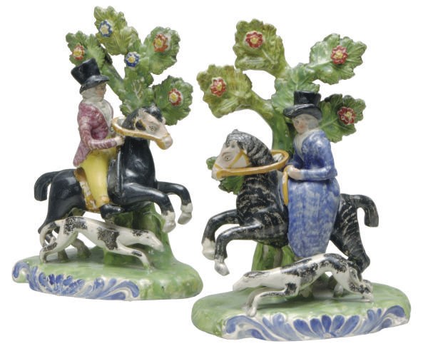 A PAIR OF STAFFORDSHIRE PEARLWARE EQUESTRIAN BOCAGE GROUPS,