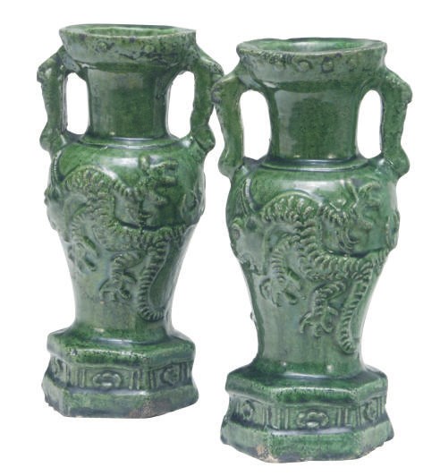 A PAIR OF MOLDED GREEN GLAZED VASES,