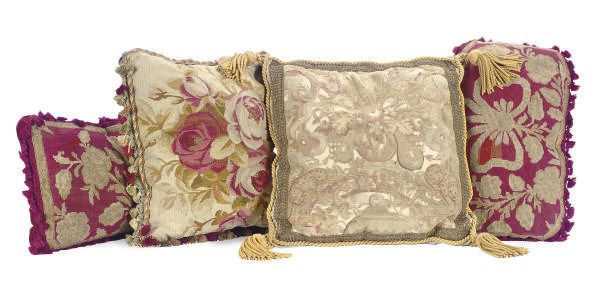 A GROUP OF NEEDLEPOINT AND TEXTILE CUSHIONS,