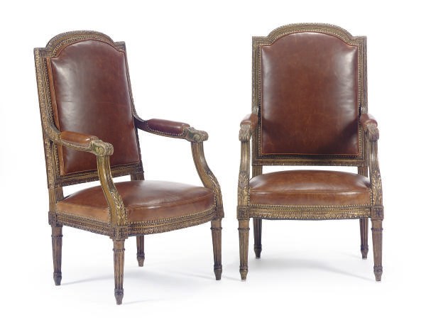 A PAIR OF FRENCH GILTWOOD AND BROWN LEATHER UPHOLSTERED FAUTEUILS,
