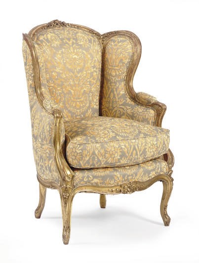 A FRENCH GILTWOOD AND PRINTED FORTUNY SILK UPHOLSTERED BERGERE A L'OREILLE,