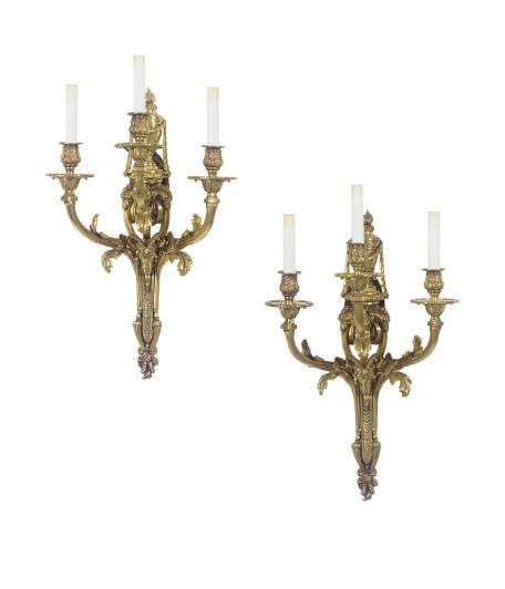 A SET OF FOUR GILT-BRONZE THREE-BRANCH WALL-LIGHTS,