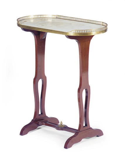A FRENCH ORMOLU-MOUNTED MAHOGANY KIDNEY-SHAPED WRITING TABLE,