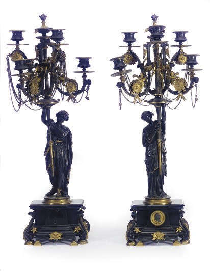 A PAIR OF FRENCH PATINATED AND GILT-BRONZE FIGURAL SIX-LIGHT CANDELABRA,