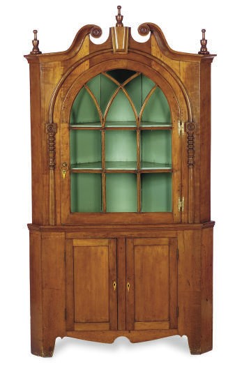 AN AMERICAN CHERRYWOOD CORNER CUPBOARD,