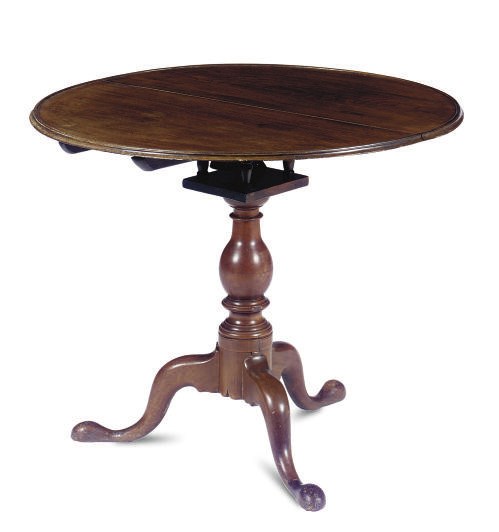 A WALNUT TILT-TOP TEA TABLE,