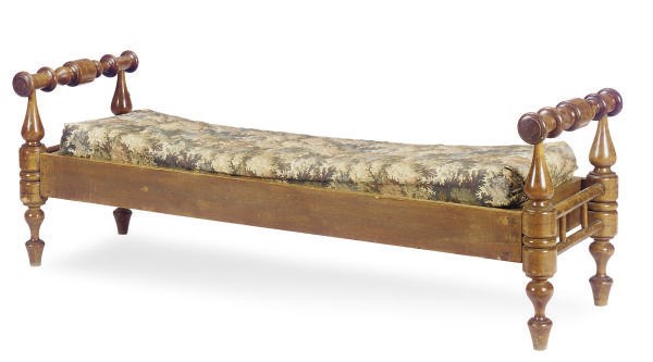 A TURNED WALNUT LOW BENCH,
