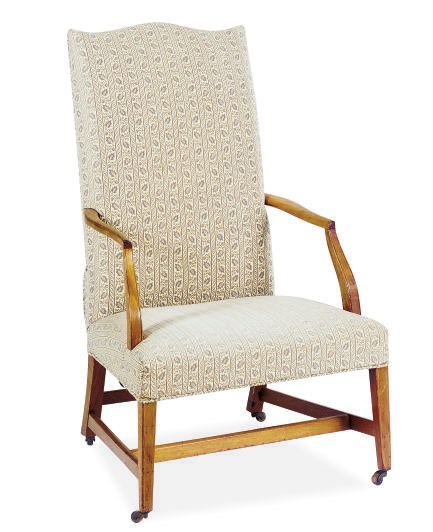 AN AMERICAN MAHOGANY AND UPHOLSTERED LOLLING CHAIR,