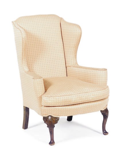 A MAHOGANY AND UPHOLSTERED WINGBACK ARMCHAIR,