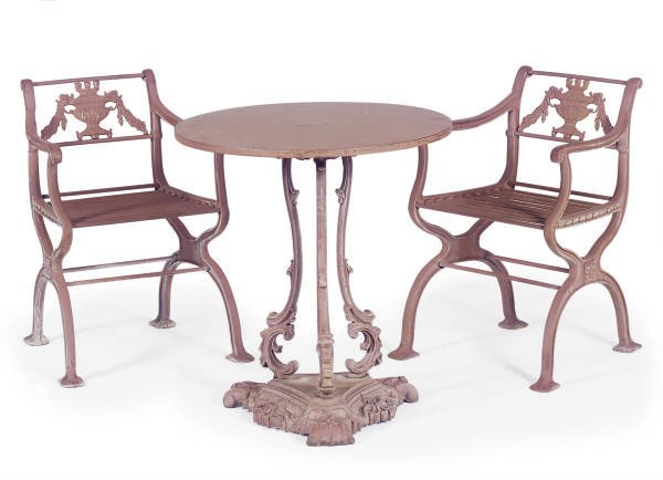 A VICTORIAN RED CAST IRON CIRCULAR TABLE TOGETHER WITH A PAIR OF ARMCHAIRS,