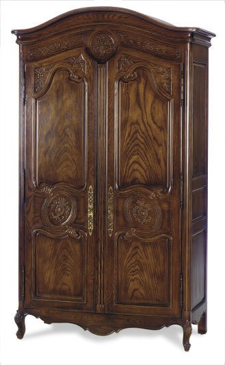 A WALNUT AND OAK ARMOIRE,
