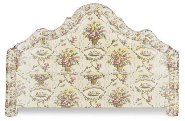 A SILK FLORAL UPHOLSTERED HEADBOARD,