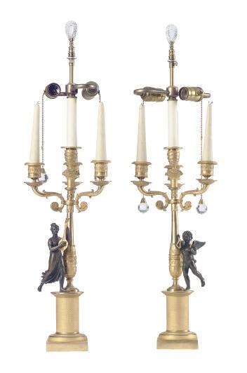 A PAIR OF FRENCH GILT-BRONZE AND PATINATED-BRONZE FOUR-LIGHT CANDELABRA MOUNTED AS TABLE LAMPS,