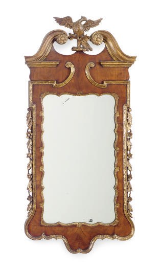 A GEORGE II WALNUT AND PARCEL-GILT MIRROR,