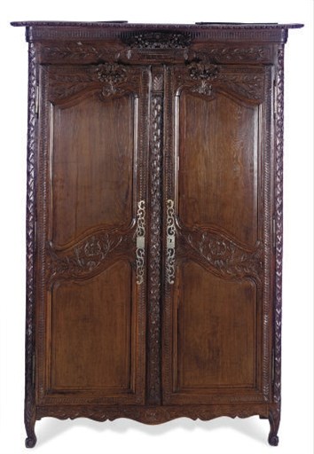 A FRENCH STAINED OAK ARMOIRE,