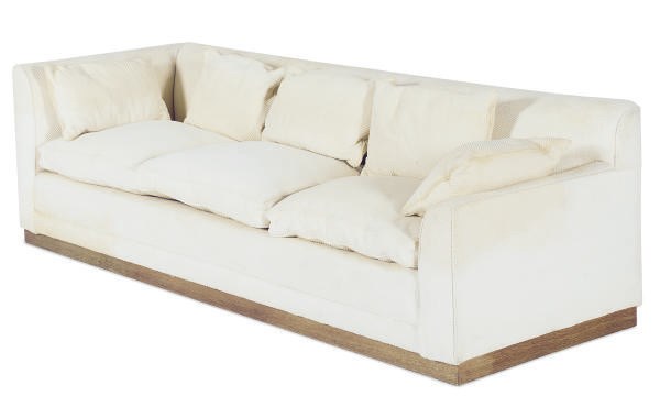 AN UPHOLSTERED THREE-SEAT SOFA,