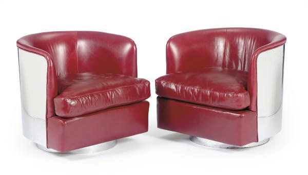 A PAIR OF CHROMED-METAL AND RED LEATHER UPHOLSTERED SWIVEL ARMCHAIRS,