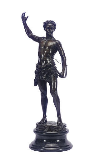 A PATINATED BRONZE FIGURE OF A HUNTER,