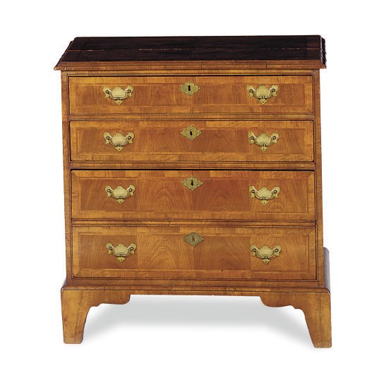 AN ENGLISH WALNUT AND FEATHERBANDED CHEST-OF-DRAWERS,