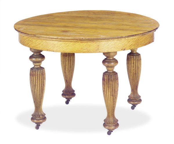 AN AMERICAN OAK EXTENDING DINING TABLE,