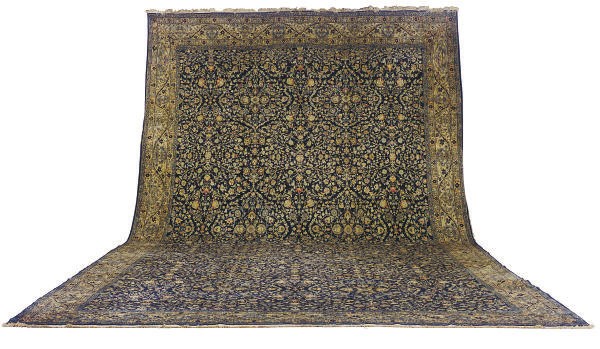 A PERSIAN STYLE CARPET,