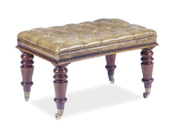 A MAHOGANY AND BUTTON-TUFFTED LEATHER UPHOLSTERED BENCH,