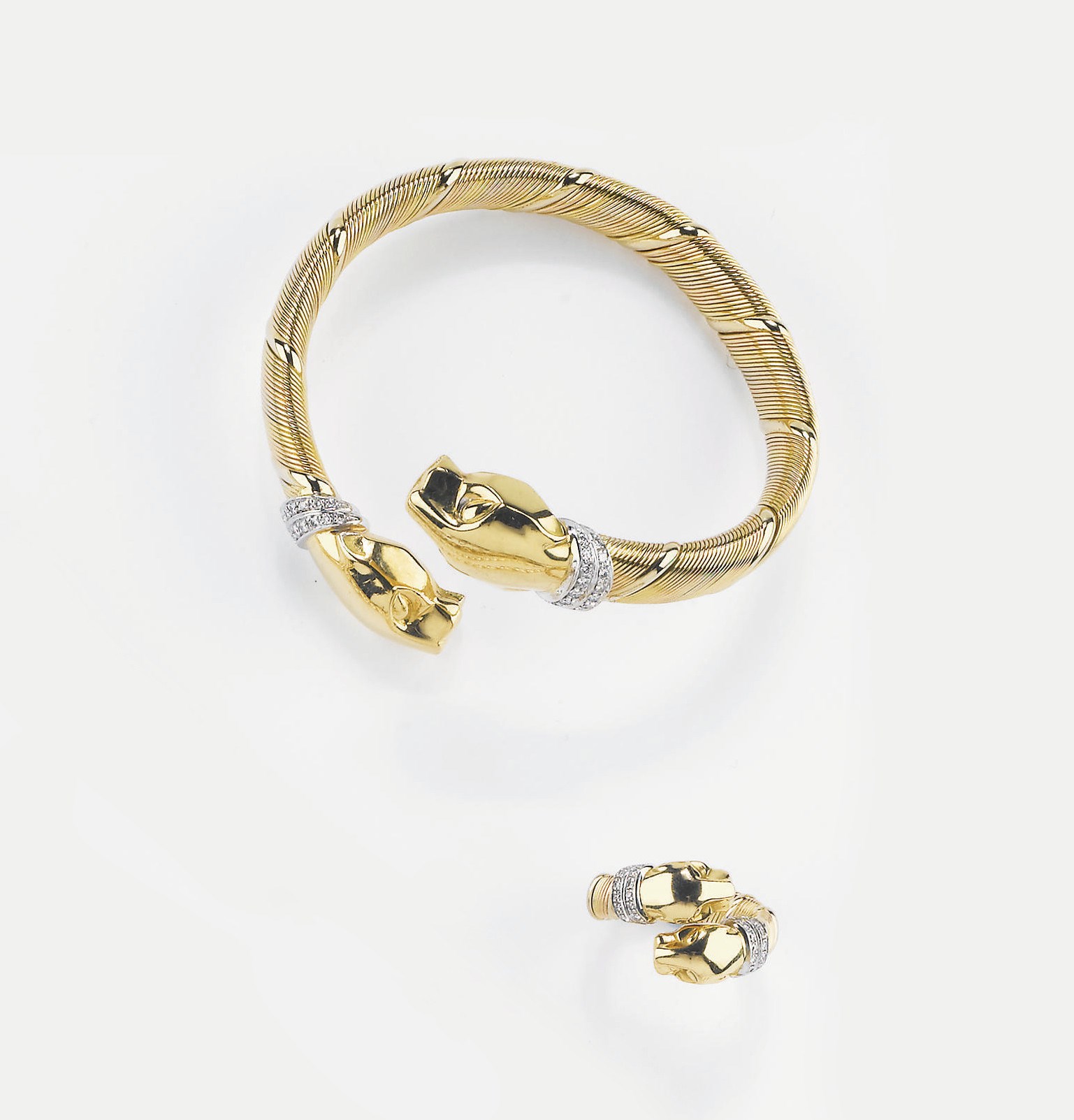PARURE "PANTHÈRE" IN ORO BICOLORE E DIAMANTI, FIRMATA CARTIER