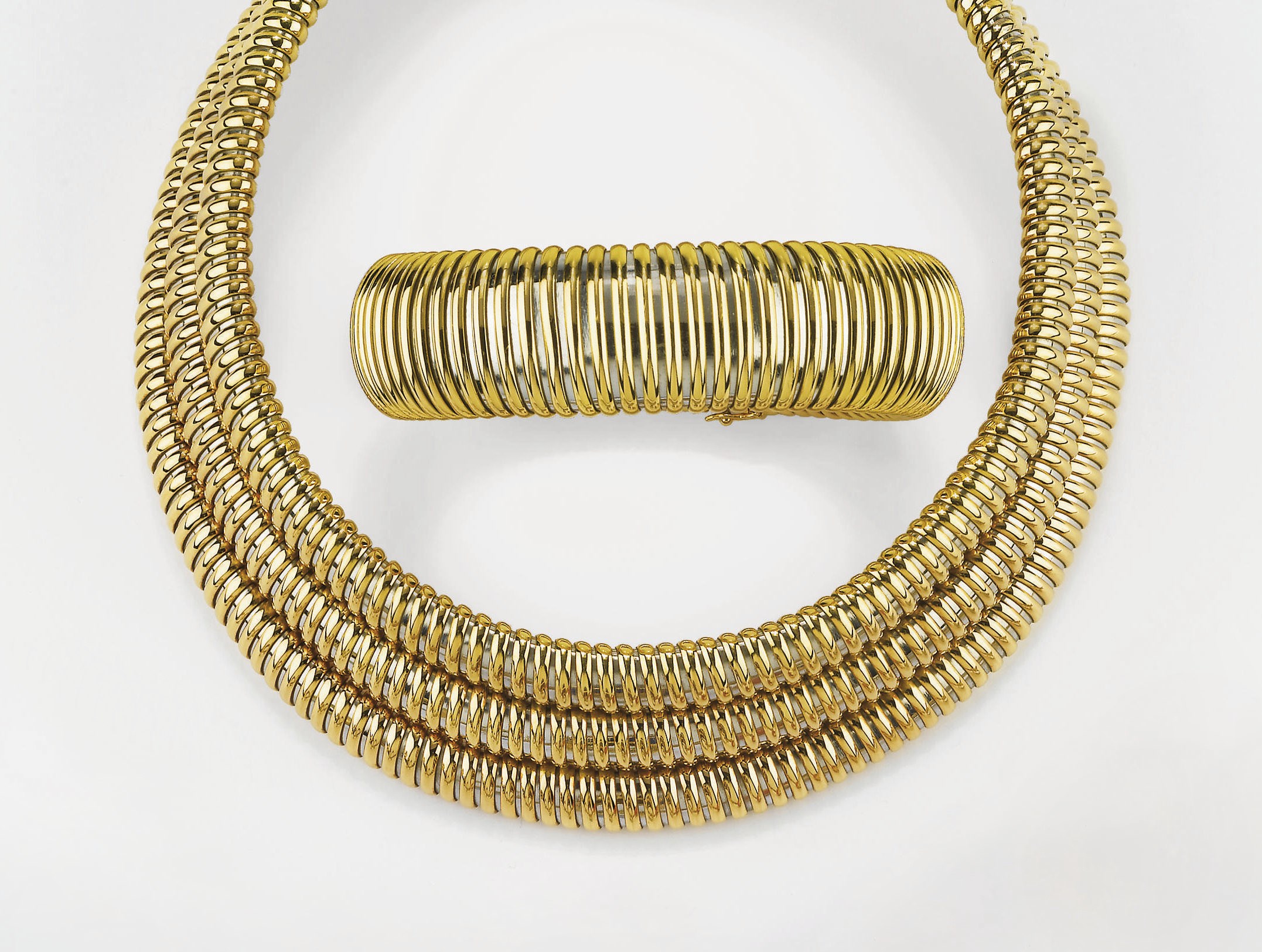 DEMI PARURE "ATOLLO" IN ORO E ACCIAIO, FIRMATA CARTIER