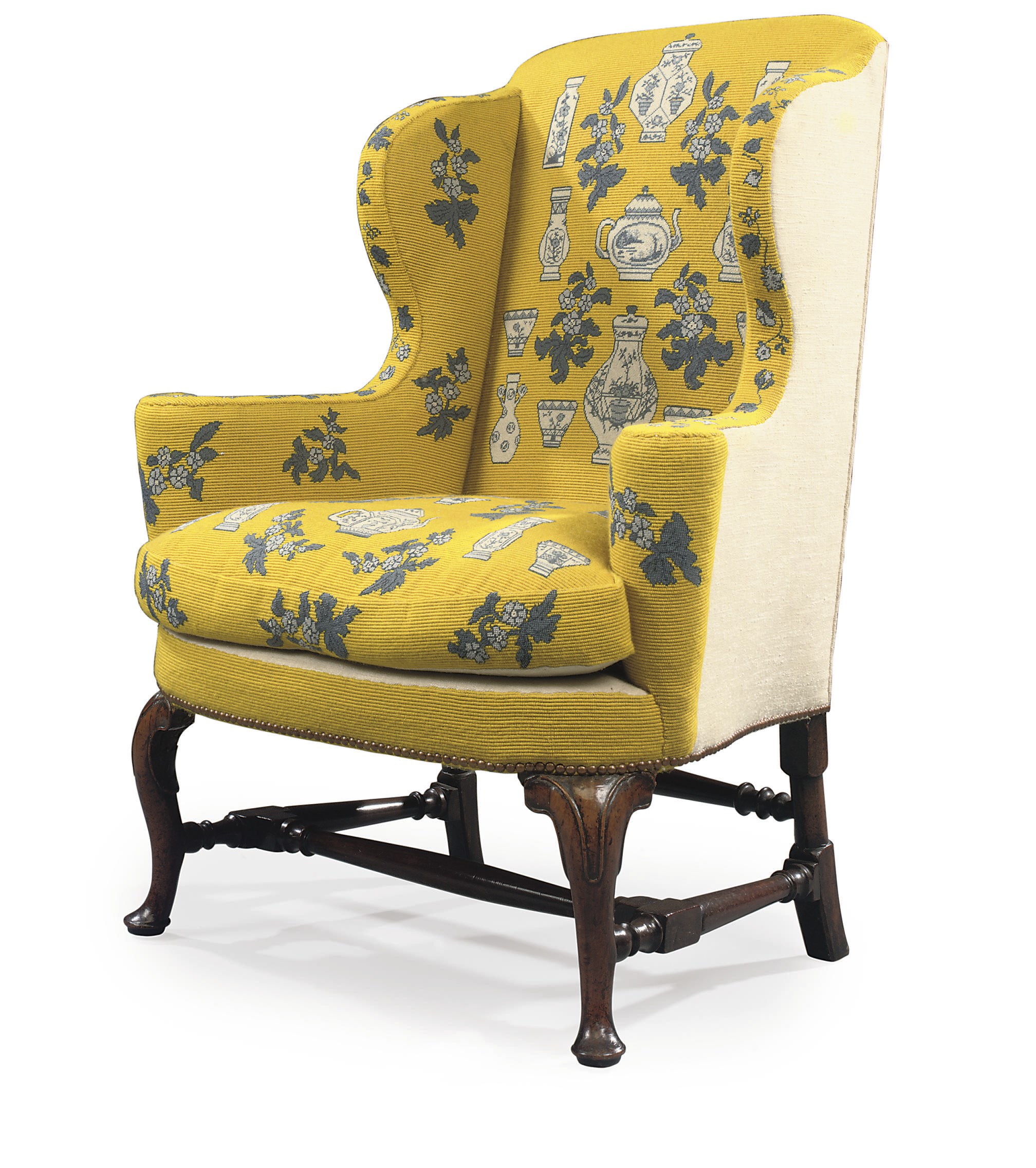 A QUEEN ANNE WALNUT WING ARMCHAIR