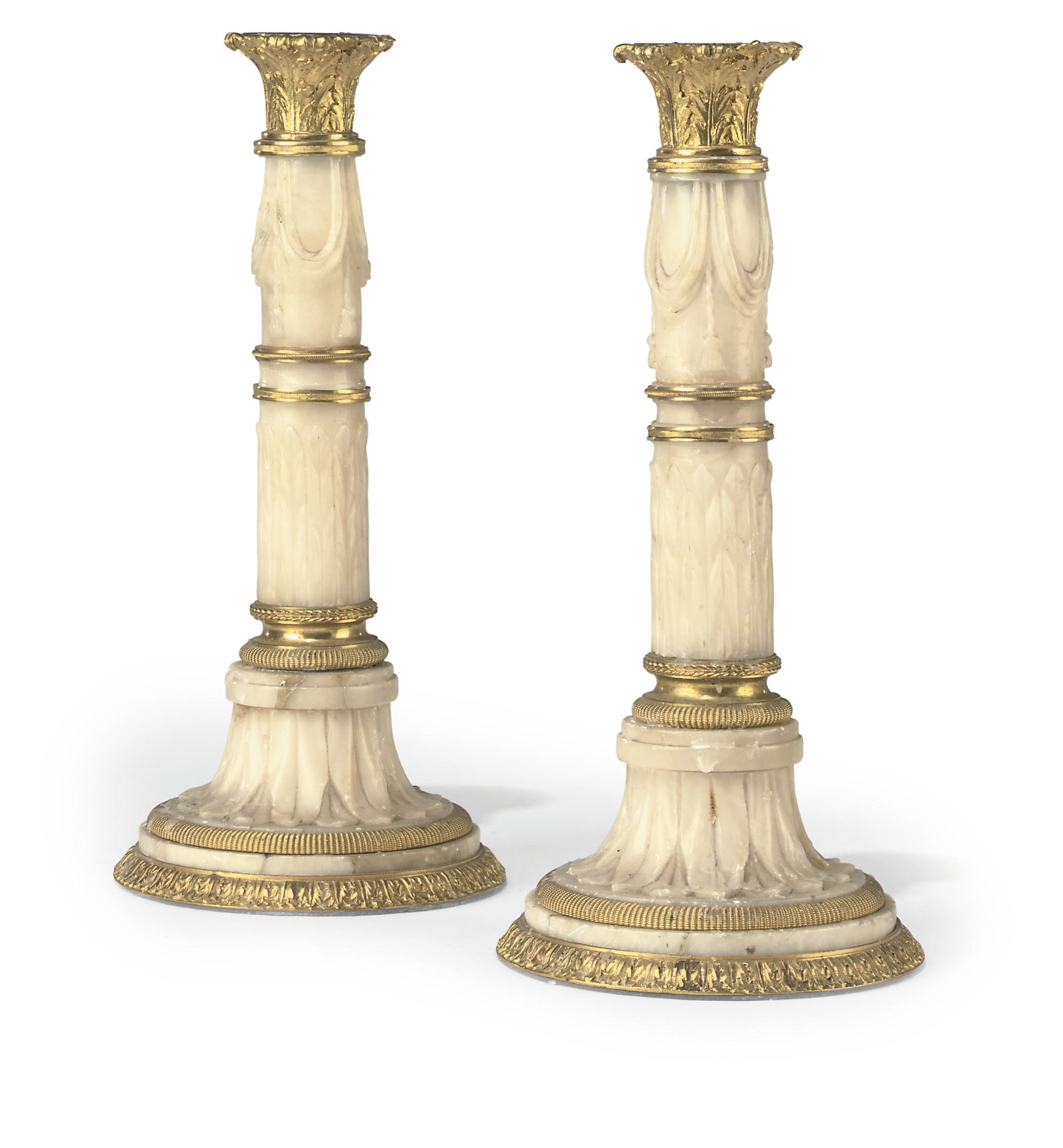A PAIR OF ITALIAN ORMOLU-MOUNTED ALABASTER CANDLESTICKS